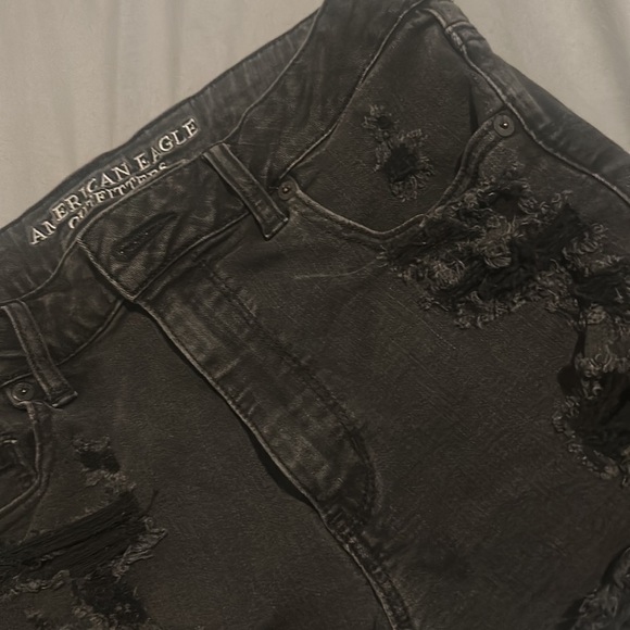 Distress black jean shorts. American Eagle.Floral lace exposed pockets. Stretchy - Picture 2 of 3